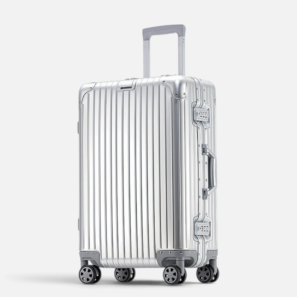 Valise MoovNext AURA en aluminium et magnésium argentée avec coque rigide rainurée et quatre roues multidirectionnelles