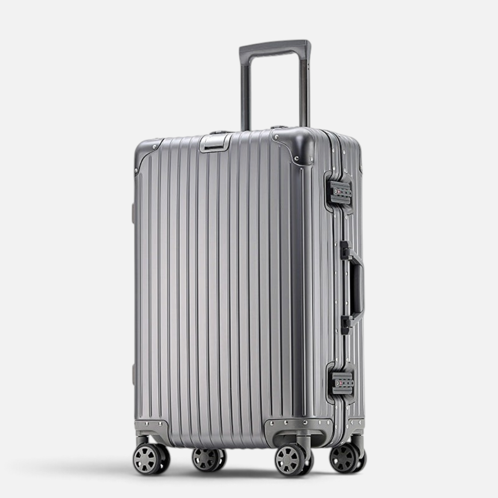 Valise MoovNext AURA en aluminium et magnésium gris avec design rainuré, poignée télescopique et quatre roues