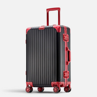Valise MoovNext AURA en aluminium et magnésium noir et rouge avec poignée télescopique et roulettes multidirectionnelles