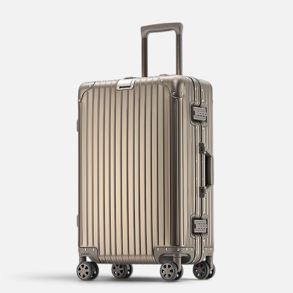 Valise MoovNext AURA en aluminium et magnésium couleur Or Titane avec design rainuré et roues multidirectionnelles