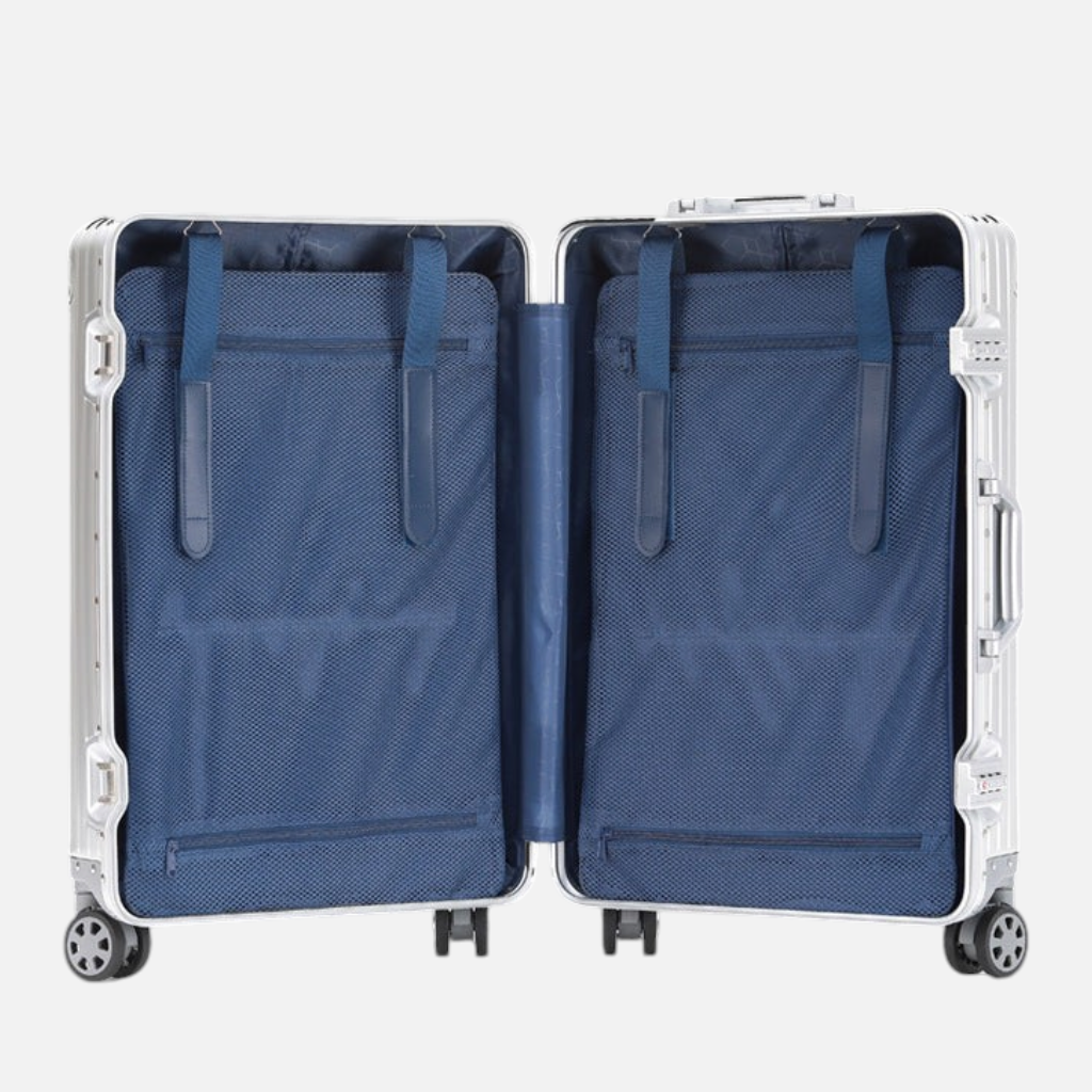Intérieur ouvert de la valise MoovNext AURA en aluminium et magnésium avec compartiments doublés en tissu bleu