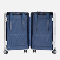 Intérieur ouvert de la valise MoovNext AURA en aluminium et magnésium avec compartiments doublés en tissu bleu